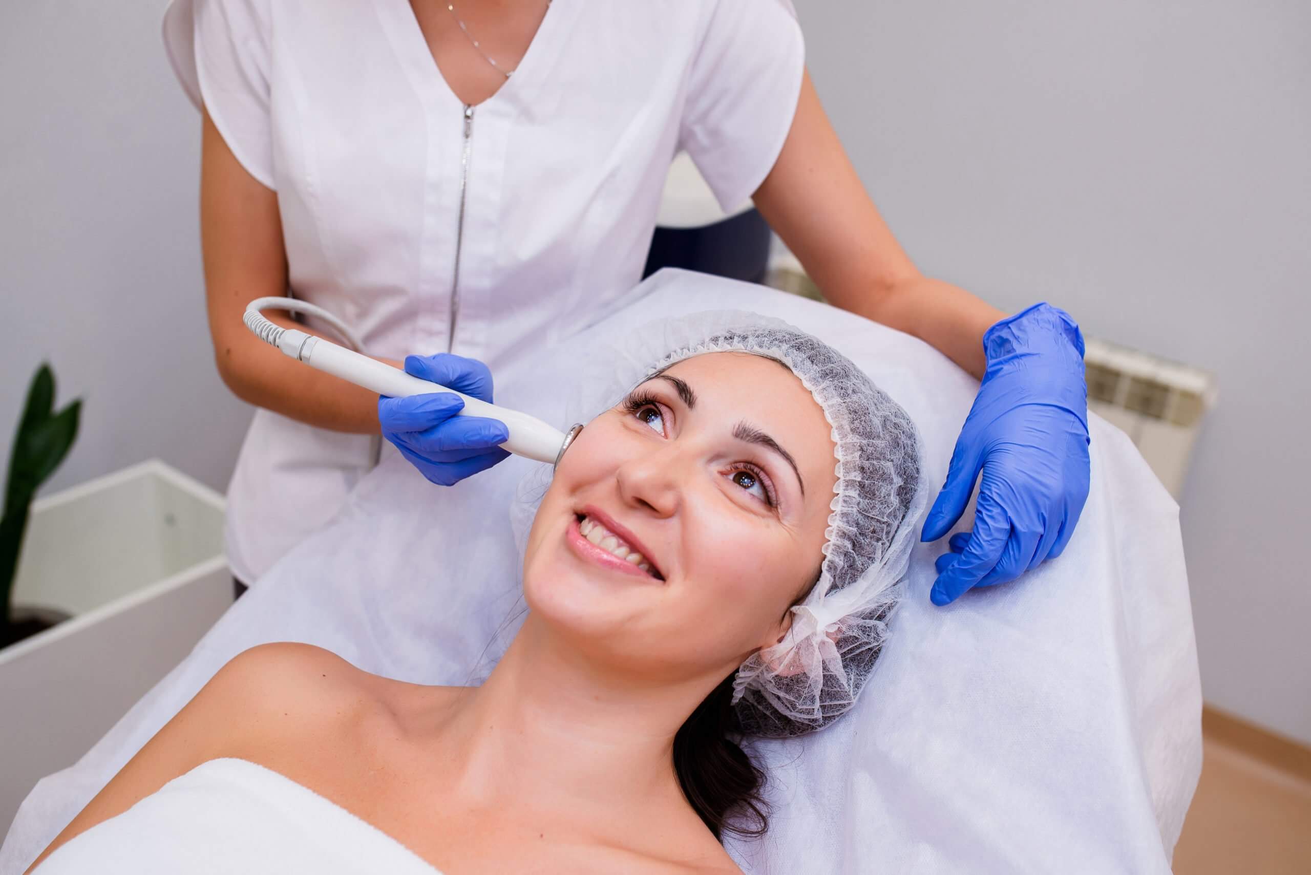 Young Happy Female Getting Hydrafacial Treatment | Glow Wellness Care in East Northport, NY